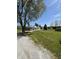 Spacious home with a wrap-around porch, detached garage, lush lawn, and ample greenery at 3333 S Sr 9, Greenfield, IN 46140