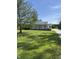 Charming home featuring a welcoming porch and well-maintained lawn with a large shade tree at 3333 S Sr 9, Greenfield, IN 46140
