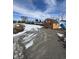 Exterior view of a shed and greenhouse with snowy ground and cloudy skies overhead at 3333 S Sr 9, Greenfield, IN 46140