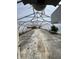 Inside a greenhouse, with concrete flooring, partial equipment, and natural light streaming through at 3333 S Sr 9, Greenfield, IN 46140