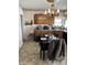 Cozy kitchen and dining area featuring wood cabinets and vintage chandelier at 3333 S Sr 9, Greenfield, IN 46140