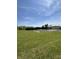 Expansive green field with rows under tarp covers and a home in the distance, perfect for farming at 3333 S Sr 9, Greenfield, IN 46140
