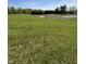 Green field with greenhouses in the background on a sunny day at 3333 S Sr 9, Greenfield, IN 46140