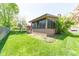 The backyard features a patio, landscaping, and views of the surrounding neighborhood at 3413 Putter Pl, Columbus, IN 47203