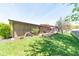 Well-maintained backyard featuring a patio, woodpile, and lush green grass for outdoor enjoyment at 3413 Putter Pl, Columbus, IN 47203