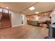 The spacious basement has wooden beams, a living area, and stairs at 3413 Putter Pl, Columbus, IN 47203