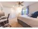 This bedroom has a ceiling fan, built-in closet, and an office setup for a flexible space at 3413 Putter Pl, Columbus, IN 47203