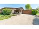 Charming home with a long driveway and a well-manicured lawn under a bright blue sky at 3413 Putter Pl, Columbus, IN 47203