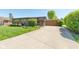 Charming home with a long driveway and a well-manicured lawn under a bright blue sky at 3413 Putter Pl, Columbus, IN 47203