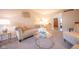 Well-lit living room showcases a tufted sofa, glass coffee table, and stylish decor and open doorway at 3413 Putter Pl, Columbus, IN 47203