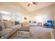 Spacious living room with vaulted ceilings, comfortable seating, and access to kitchen view at 3413 Putter Pl, Columbus, IN 47203