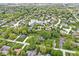 A neighborhood with homes surrounded by green trees and a beautiful lake in the center at 3790 Steeplechase Dr, Carmel, IN 46032