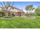 Expansive backyard features a stone-accented flower bed, well-maintained lawn, and a patio at 3790 Steeplechase Dr, Carmel, IN 46032
