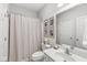 Bright bathroom featuring a vanity with sink, toilet, framed art, and shower with curtain at 3790 Steeplechase Dr, Carmel, IN 46032