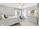 Bright bedroom with a ceiling fan, white furnishings, and a window providing natural light at 3790 Steeplechase Dr, Carmel, IN 46032