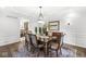 Elegant dining room featuring a wooden table, patterned chairs, and a decorative chandelier at 3790 Steeplechase Dr, Carmel, IN 46032