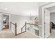 Bright and airy foyer with elegant staircase, chandelier, and natural light from arched window at 3790 Steeplechase Dr, Carmel, IN 46032