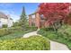Inviting home entrance with a well-manicured garden, decorative flowers, and stylish walkway at 3790 Steeplechase Dr, Carmel, IN 46032