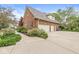 Spacious three-car garage with an extra room, complemented by a well-maintained driveway and surrounding greenery at 3790 Steeplechase Dr, Carmel, IN 46032