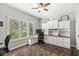 Functional home office space with custom built-in cabinets, desk, and large window view at 3790 Steeplechase Dr, Carmel, IN 46032