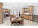 Inviting kitchen with wooden cabinets, granite countertops, and an adjacent dining area at 3790 Steeplechase Dr, Carmel, IN 46032