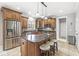 Spacious kitchen features a large granite island, stainless steel appliances and custom wood cabinets at 3790 Steeplechase Dr, Carmel, IN 46032