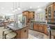 Open kitchen with large island, stainless steel appliances, granite countertops, and a breakfast nook at 3790 Steeplechase Dr, Carmel, IN 46032