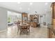 Spacious kitchen with a center island, wooden cabinetry, and an adjoining dining area at 3790 Steeplechase Dr, Carmel, IN 46032