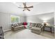 Living room with a large sectional sofa, window, and neutral color palette at 3790 Steeplechase Dr, Carmel, IN 46032