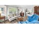 Cozy living room with hardwood floors, a comfortable sofa, and natural light at 3790 Steeplechase Dr, Carmel, IN 46032