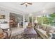 Cozy living room with large windows, comfortable seating, and open floor plan to dining area at 3790 Steeplechase Dr, Carmel, IN 46032