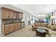 Open-concept living room featuring a wet bar, plush seating, and a cozy fireplace, perfect for entertaining at 3790 Steeplechase Dr, Carmel, IN 46032