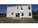 A backyard featuring a patio and sliding glass doors at 3832 Highcrest Rd, Indianapolis, IN 46239