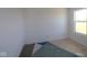 A bright bedroom with a window showcasing the empty room at 3832 Highcrest Rd, Indianapolis, IN 46239