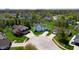 Aerial view of suburban neighborhood with mature trees, well-maintained lawns, and various home styles at 4243 Bay Leaf Cir, Indianapolis, IN 46237