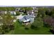 Aerial view of a home with a large backyard, mature trees, and a well-maintained lawn in a suburban neighborhood at 4243 Bay Leaf Cir, Indianapolis, IN 46237