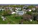 An aerial view of a neighborhood with mature trees and well-maintained lawns at 4243 Bay Leaf Cir, Indianapolis, IN 46237