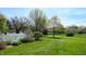 Large grassy backyard featuring lush landscaping and a secure fence, providing ample space for recreation at 4243 Bay Leaf Cir, Indianapolis, IN 46237