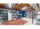 Spacious basement offers ample storage on shelves and large area rug at 4243 Bay Leaf Cir, Indianapolis, IN 46237