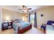 Cozy bedroom with dark wood furniture, carpeted floor and natural light at 4243 Bay Leaf Cir, Indianapolis, IN 46237