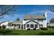 Two-story home featuring white siding, covered porch, well-maintained landscaping, and a spacious yard at 4243 Bay Leaf Cir, Indianapolis, IN 46237