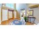 Inviting foyer with hardwood floors, ample natural light, and stylish accents at 4243 Bay Leaf Cir, Indianapolis, IN 46237