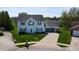 Two-story home with a well-manicured front lawn and driveway, featuring a two-car garage at 4243 Bay Leaf Cir, Indianapolis, IN 46237
