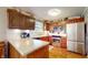 Well-lit kitchen featuring wooden cabinetry, stainless steel appliances, and a white countertop at 4243 Bay Leaf Cir, Indianapolis, IN 46237