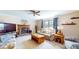 Cozy living room with fireplace, comfortable seating, and ceiling fan at 4243 Bay Leaf Cir, Indianapolis, IN 46237