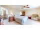 Spacious main bedroom with a ceiling fan, adjacent sitting area, and neutral walls at 4243 Bay Leaf Cir, Indianapolis, IN 46237