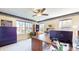 Spacious home office with natural light, ample desk space, a ceiling fan, and organized storage at 4243 Bay Leaf Cir, Indianapolis, IN 46237