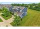 Aerial view of the home showcasing its manicured lawn, two-car garage, and great curb appeal at 4245 W Fork Dr, Westfield, IN 46062