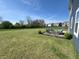 Large backyard showcasing a stone patio with outdoor furniture at 4245 W Fork Dr, Westfield, IN 46062