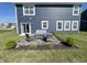 Cozy backyard patio area, complete with outdoor furniture and landscaping at 4245 W Fork Dr, Westfield, IN 46062